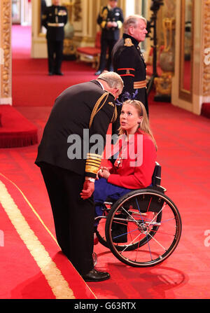 Hannah Cockroft receiving her Member of the British Empire (MBE) medal from the Prince of Wales at an Investiture ceremony at Buckingham Palace, central London. Stock Photo