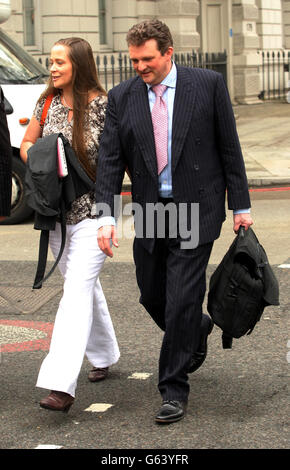 John Hardy, 43, who served as a Colour Sergeant at the Royal Military Training Academy at Sandhurst, and his 39-year-old wife, Claire Hardy arriving at Westminster Magistrates Court in central London where they are accused with conspiracy to commit misconduct in a public office between February 9 2006 and October 16 2008. Stock Photo