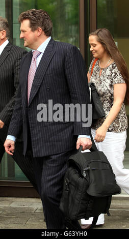 John Hardy, 43, who served as a Colour Sergeant at the Royal Military Training Academy at Sandhurst, and his 39-year-old wife, Claire Hardy leaving Westminster Magistrates Court in central London where they are accused with conspiracy to commit misconduct in a public office between February 9 2006 and October 16 2008. Stock Photo
