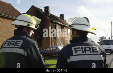 Two firefighters at the scene of a blaze at a cottage close to the village of Stert, near Devizes, where four people died in the early hours of the morning. *..The fire was attended by retained firemen and a crew of five from the nearby village of Calne, who are members of the Fire Brigades Union, broke their strike to assist efforts to rescue the victims. Ambulance personnel took one man from the scene to Princess Margaret Hospital in Swindon. Up to last night there had been three deaths in house fires since the strike by full time fireman started at 6pm on Wednesday. Stock Photo