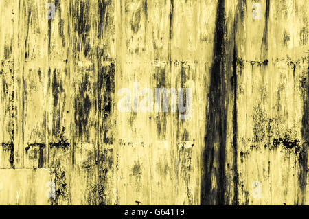 Rough yellow yellowish Iron industrial style surface background metal board with rust and heavy traces of the past Stock Photo