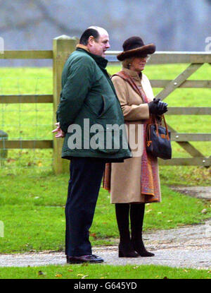 Conservative MP Nicholas Soames with the Prince of Wales' companion Camilla Parker Bowles as they walk to St. Mary's Church at the Sandringham estate in Norfolk. Prince William failed to join his friends, and father, at the church service. Stock Photo