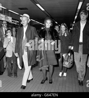 Hollywood crooner Bing Crosby, who is known to his friends as Old Groaner, arrives at Heathrow Airport from New York. With him are his wife, Katherine, daughter Mary (background right) and nephew Bill Myers (right). Stock Photo