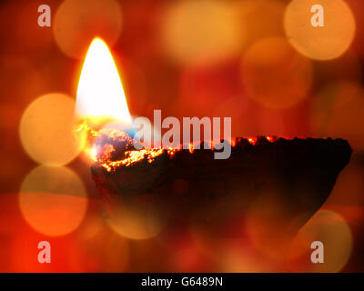 A traditional lamp lit on the occassion of Diwali festival in India. Stock Photo