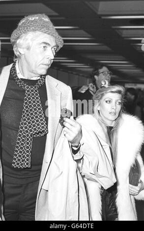 James Coburn and singer/songwriter Lynsey de Paul at London's Heathrow airport to see him off to Los Angeles. Stock Photo