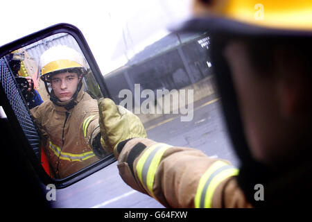 Private Adrian Poursain of the Princess of Wales Royal Regiment from Turnhill, Shropshire, practises fire drill in a Belfast Army base, on the first day of the Fire Brigades Union's eight day strike. The Government today welcomed the agreement of the Fire Brigades Union to provide emergency cover to deal with large-scale terrorist or other civil contingency incidents. Home Secretary David Blunkett said this was particularly important in view of the heightened threat levels . Stock Photo