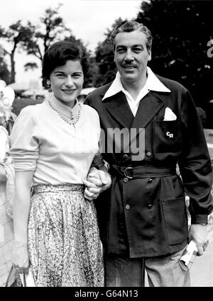 Glamorous Wimbledon star, Nancy Chaffee of America, pictured with film actor Cesar Romero, when they arrived for the third day of Wimbledon. Stock Photo