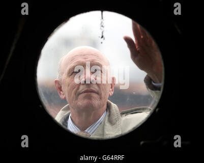 Captain John Rees, Chief of Staff at the National Museum of the Royal Navy is seen through a porthole on HMS Caroline as the First World War's last surviving battleship is on course to be transformed into a floating museum after provisionally securing a &pound;12 million lottery funding boost. Stock Photo