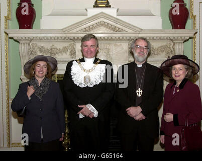 The Most Reverend Dr Rowan Williams (second right) stands with his wife, Jane (left), the Lord Mayor of the City of London Alderman Gavyn Arthur and the Lady Mayoress Carole Blackshaw inside Mansion House in London. *The Dr was officially confirmed as the new Archbishop of Canterbury and a luncheon was given in his honour following a service at St Paul's Cathedral in London. Stock Photo