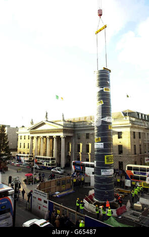 The first section of Dublin's new monument being placed on its base in O'Connell Street, Dublin, Republic of Ireland. * The state-of-the-art illuminated monument that reaches 120 metres into the sky will dominate the landscape of Dublin's most famous street and has been irreverently christened The Spike by locals. Stock Photo