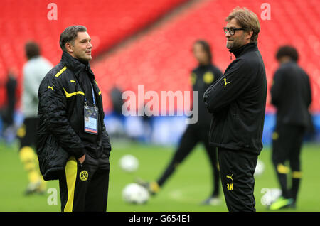 Borussia Dortmund's manager Jurgen Klopp (r) speaks with sports manager Michael Zorc Stock Photo