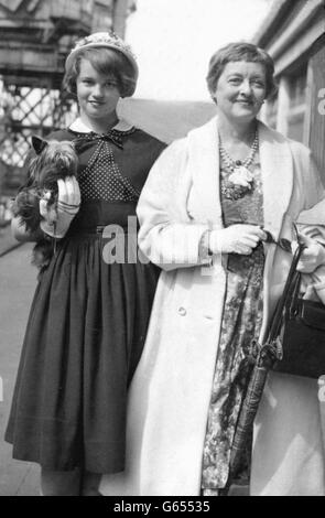 Bette Davis with her daughter, Barbara Davis Merrill and pet dog, Lord Pip Mountbatten when leaving Southampton. Stock Photo