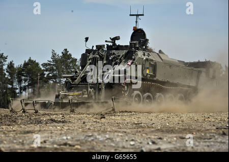 A Terrier armoured digger in the mine clearance role, which is entirely controlled remotely during an unveilling at the Defence Armoured Vehicle Centre, Bovington, Dorset. PRESS ASSOCIATION Photo. Picture date: Tuesday July, 4, 2013. See PA story DEFENCE Terrier. Photo credit should read: Ben Birchall/PA Wire Stock Photo