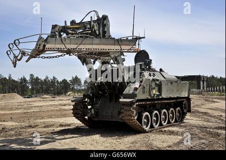 A Terrier armoured digger in the mine clearance role, which is entirely controlled remotely during an unveilling at the Defence Armoured Vehicle Centre, Bovington, Dorset. Stock Photo