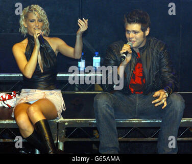 Sarah Harding from Popstars: The Rivals winners, Girls Aloud with Westlife's Bryan McFadden on stage during G.A.Y at the Astoria in London. Stock Photo