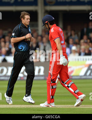 England's Alastair Cook (right) leaves the field after being caught behind off the bowling of New Zealand's Tim Southee (left) for 30 during the First One Day International at Lord's Cricket Ground, London. Stock Photo