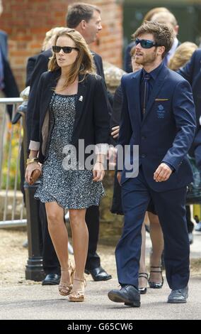 Olympic silver medallist Hannah Mills arrives with team-mate Luke Patience arrives for the funeral of Andrew 'Bart' Simpson in Sherbourne, Dorset. Stock Photo