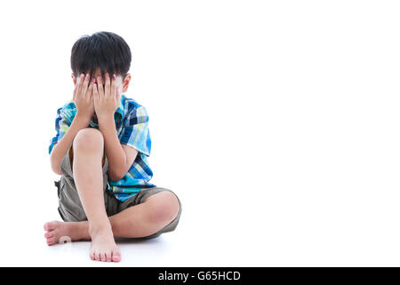Full body. Little sad boy covered his face with hands. Isolated on white background. Negative human emotions. Conceptual about c Stock Photo
