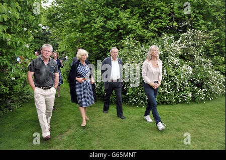 The Duchess of Cornwall with gardener Nick Powell Pink Floyd drummer Nick Mason and his wife Annette during a visit to Middlewick House in Pickwick, Wiltshire, the home of Pink Floyd drummer Nick Mason, which is holding a charitable garden open day. Stock Photo