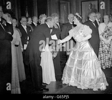 The Rt. Hon. Clement Attlee, Prime Minister, being presented to her Majesty the Queen at a reception in London held by the Chairman of the London County Council (Lady Nathan) at County Hall in Westminster, for their Majesties the King and Queen. Stock Photo
