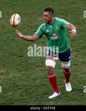 British and Irish Lions' Toby Faletau cools off with the fans during a ...