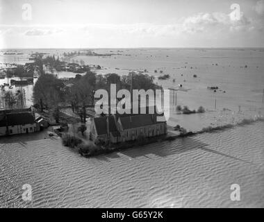 A church is seen surrounded by flood water in this air picture taken in the area of Foulness, Thames Estuary island, overwhelmed in the flood disaster. The island's population of 350 were cut off by the floods but Southend lifeboat reported by radio that it had made contact with people on the top floors of houses. Stock Photo