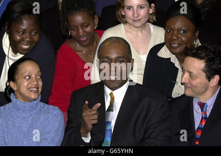 Trevor Phillips (centre), the new Chair of the Commission for Racial Equality, meets members of staff in London. * Broadcaster and London Assembly chairman Trevor Phillips was appointed chairman of the Commission for Racial Equality after the organisation's former head, Gurbux Singh, resigned last summer after a drunken row with a policeman outside Lord's cricket ground. Mr Phillips said: 'I am delighted to be given the opportunity to lead the CRE in its twin tasks of helping to bring all our diverse communities together and in rooting out racism and discrimination in all its forms. Stock Photo