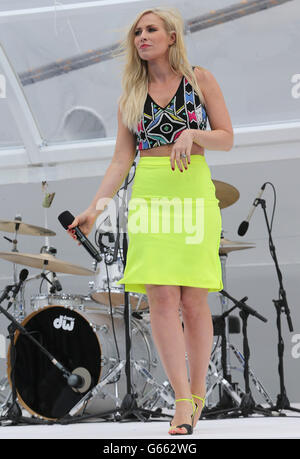 Pop singer Natasha Bedingfield performs as the Duchess of Cambridge attends the Princess Cruises ship naming ceremony at Ocean Terminal, Southampton. Stock Photo