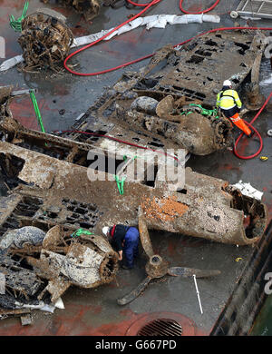 The remains of a crashed World War II Dornier bomber, the only surviving German Second World War Dornier Do 17 bomber, lays on a barge near Deal in the English Channel after being raised from the sea bed yesterday Evening. Stock Photo