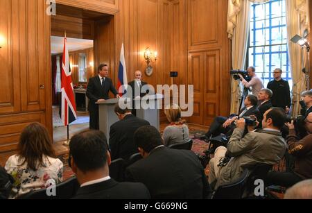 Prime Minister David Cameron (left) with Russian President Vladimir Putin, during a press conference at 10 Downing Street, London. Stock Photo