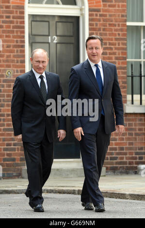 Prime Minister David Cameron (right) greets Russian President Vladimir Putin outside 10 Downing Street, London. Stock Photo