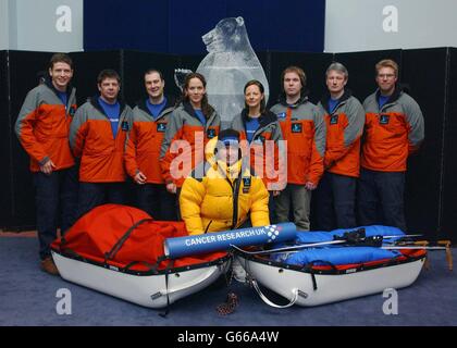 Jim McNeill, (centre) dressed in full polar suit with members of his team (from left) Andy McLaughlin, Mark Wood, Gary Quinn, Julia Stacey, Fizzy Lillington, Matthew Edwards, John Burness and Ben Edwards, during a photocall at the Natural History Museum, London, *..to launch his bid to become the first solo explorer to reach all four Arctic poles. McNeill, 42, a fire surveillance officer at Windsor Castle, hopes to smash five records on next month s ice adventure including walking to the Arctic, the Magnetic, the Geomagnetic and the Geographic poles, while raising awareness of Cancer Research Stock Photo