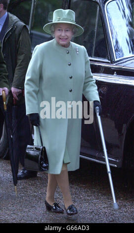 HRH Queen Elizabeth II walking with the aid of a stick as she arrives in Sandringham to carry out her first official public engagement since under going surgery on her right knee 16 days ago. Stock Photo