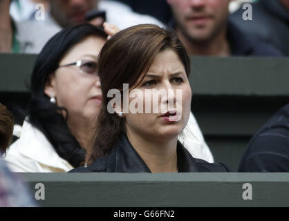 Mirka Federer, watches her husband Switzerland's Roger Federer in his match against Ukraine's Sergiy Stakhovsky during day Three of the Wimbledon Championships at The All England Lawn Tennis and Croquet Club, Wimbledon. Stock Photo