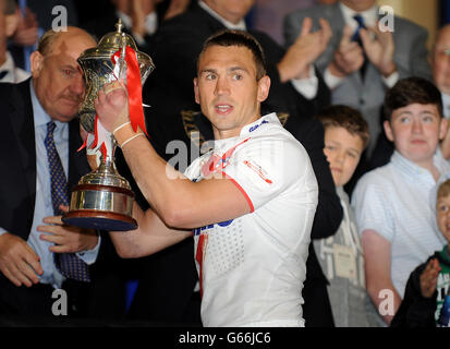 England Captain, Kevin Sinfield lifts the International Origin Match Trophy after victory the Interational match at the Halliwell Jones Stadium, Warrington. Stock Photo