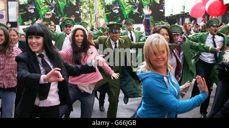 Harrods summer sale. A flash mob dance outside Harrods in Knightsbridge, central London, as they launch its summer sale. Stock Photo