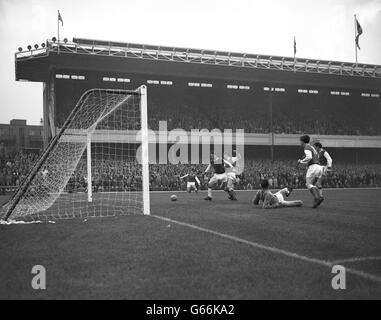 Soccer - League Division One - Arsenal v Ipswich Town - Highbury Stadium. Arsenal's Geoff Strong (arms raised) scores in Arsenal's 6-0 romp over Ipswich Town. The Ipswich Town goalkeeper is Roy Bailey. Stock Photo