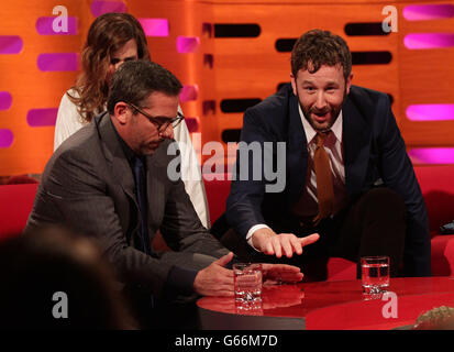 Guests Steve Carell and Kristen Wiig react after Chris O'Dowd found a fly in his drink, during filming of The Graham Norton Show (TX: 22:35 Friday June 21, BBC One), at The London Studios in south London. Stock Photo