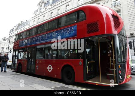 The new Routemaster bus used on the 38 route passes The Ritz Hotel on Piccadilly, London. Services will start tomorrow on the first route to be served entirely by the new generation of hop-on, hop-off 'Boris buses'. Stock Photo