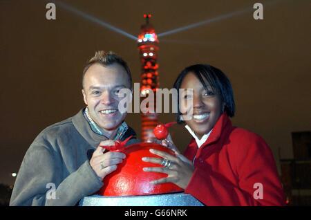 Comedian Graham Norton and CBBC presenter Angellica Bell during a photocall in London where they turned the BT Tower bright red, to officially launch Comic Relief's 2003 campaign for Red Nose Day (14 March). Stock Photo