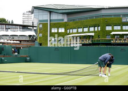 Tennis - 2013 Wimbledon Championships - Day One - The All England Lawn Tennis and Croquet Club. Court preparations are made for day one of the Wimbledon Championships at The All England Lawn Tennis and Croquet Club, Wimbledon. Stock Photo