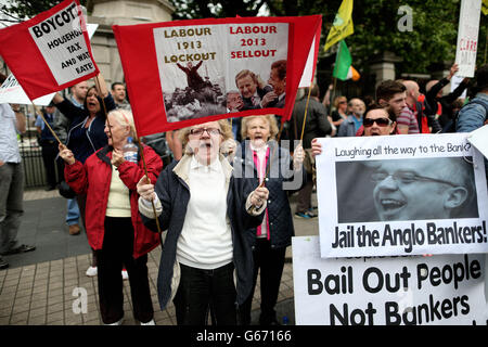 Protestors outside Leinster House, Dublin, show their anger at the government's handling of the financial crisis and the Anglo Irish Bank scandal. PRESS ASSOCIATION Photo. Picture date: Wednesday July 3, 2013. See PA story POLITICS Anglo Ireland. Photo credit should read: Julien Behal/PA Wire Stock Photo