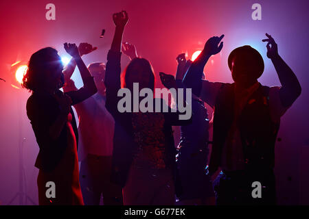Disco dancing in red light Stock Photo