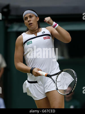 France's Marion Bartoli celebrates winning the first set against Belgium's Kirsten Flipkins during day ten of the Wimbledon Championships at The All England Lawn Tennis and Croquet Club, Wimbledon. Stock Photo