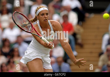 Germany's Sabine Lisicki in action against Poland's Agnieszka Radwanska during day ten of the Wimbledon Championships at The All England Lawn Tennis and Croquet Club, Wimbledon. Stock Photo