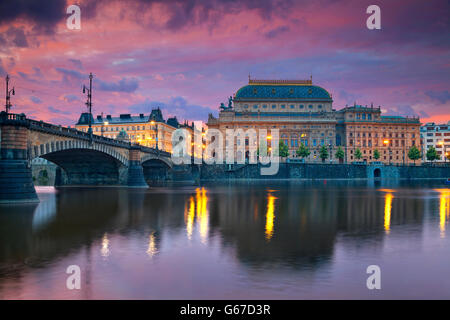 Prague. Image of Prague riverside with reflection of the city in Vltava River and National Theatre. Stock Photo