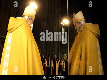 The Archbishop of Canterbury Dr Rowan Williams stands at the West door of Canterbury Cathedral, prior to his Enthronement ceremony. Williams formally began his tenure as the 104th Archbishop of Canterbury today with an enthronement sermon urging tolerance. *..The new leader of 70 million Anglicans across the globe explained in very personal terms his vision for the future of the Church, and why Christians must engage with passion in the world of politics. Stock Photo