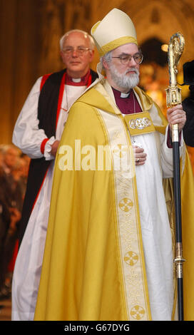 The 104th Archbishop of Canterbury, Dr Rowan Williams, leaves the West door of Canterbury Cathedral after his Enthronement ceremony. * Dr Williams delivered his enthronement sermon with the Prince of Wales, the Prime Minister and religious leaders from all over the world listening in the packed, medieval Cathedral in Canterbury. He said the future success of the Anglican Church lay in showing gratitude and joy for Jesus s life. Stock Photo