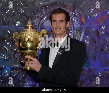 Tennis - 2013 Wimbledon Championships - Day Thirteen - Champions Ball - Intercontinental Hotel. Andy Murray poses with the mens singles trophy during the Champions Ball at the Intercontinental Hotel, London. Stock Photo