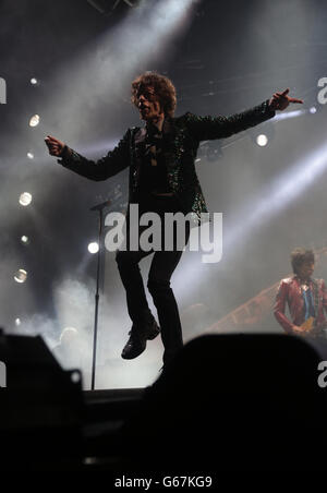 Mick Jagger from the Rolling Stones performs on the Pyramid Stage during the second performance day of the Glastonbury 2013 Festival of Contemporary Performing Arts at Pilton Farm, Somerset. Stock Photo